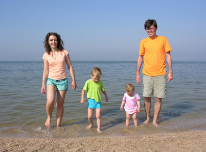 family of four on beach family of four on beach
