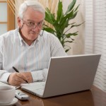 How will you end your business? senior man with laptop